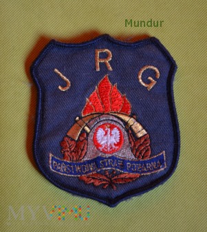 Emblemat PSP na podkładce granatowej