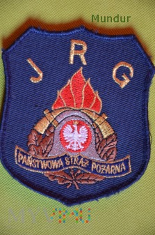Emblemat PSP na podkładce granatowej