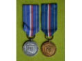 Odznaka za Zasługi dla OC - srebrna i brązowa