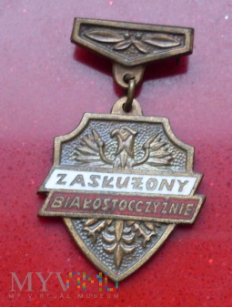 Brązowa odznaka Zasłużony Białostocczyźnie.